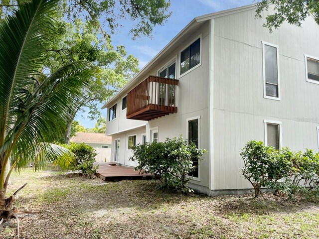 rear view of house featuring a deck