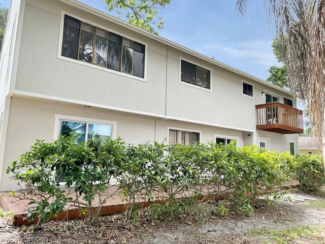 view of side of property featuring a balcony