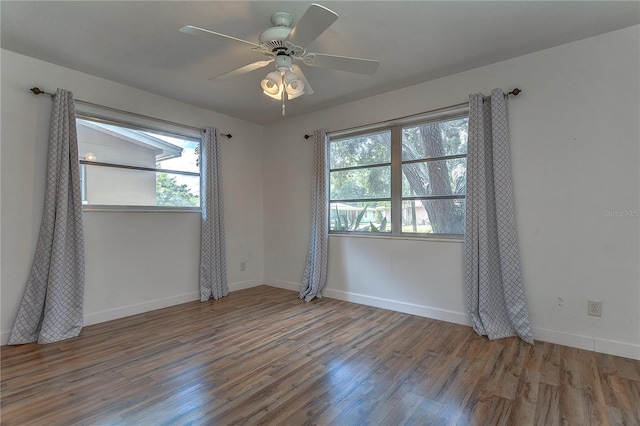 spare room featuring ceiling fan and hardwood / wood-style flooring