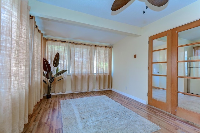 unfurnished room featuring ceiling fan and hardwood / wood-style floors