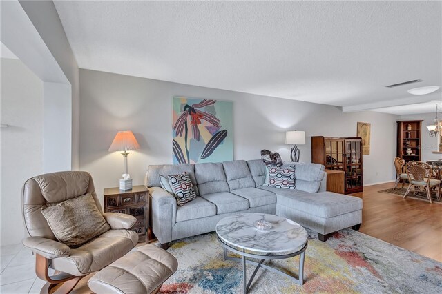 19029 US Highway 19 N Unit 12B, Clearwater, FL 33764 - living area with a textured ceiling and wood finished floors