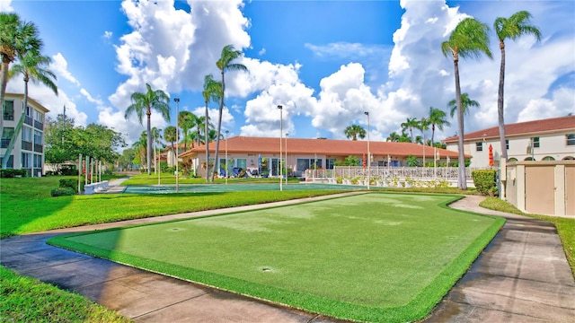 view of home's community with a lawn