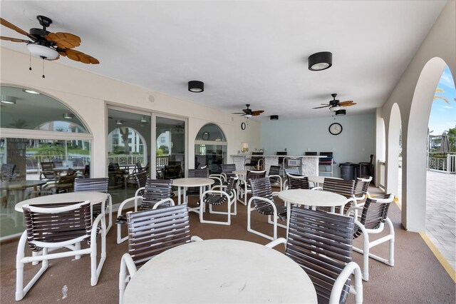 19029 US Highway 19 N Unit 12B, Clearwater, FL 33764 - view of patio / terrace with a ceiling fan and outdoor dining area