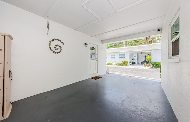 garage with concrete block wall