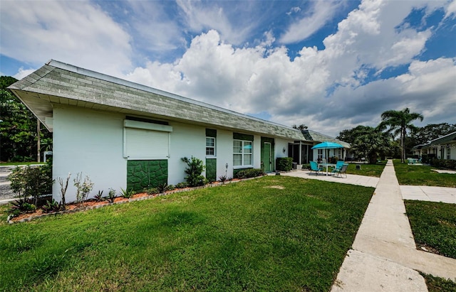 exterior space with a patio and a front yard