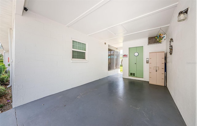 garage featuring concrete block wall