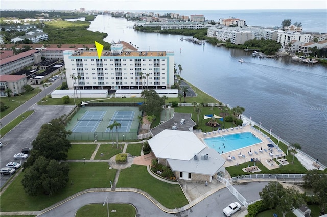 drone / aerial view featuring a view of city and a water view