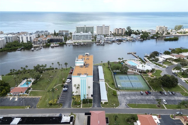 birds eye view of property featuring a view of city and a water view