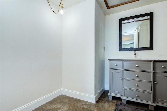 bathroom featuring baseboards and vanity