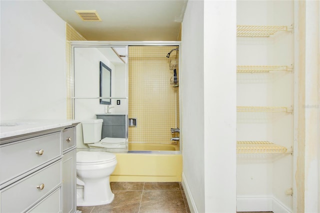 full bath featuring baseboards, visible vents, toilet, tub / shower combination, and vanity