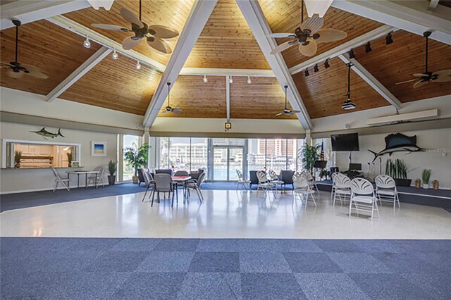 interior space with high vaulted ceiling and ceiling fan