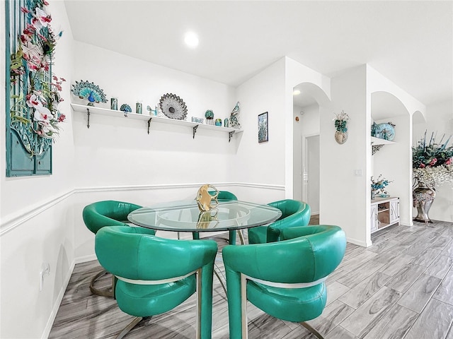 dining space with light hardwood / wood-style floors