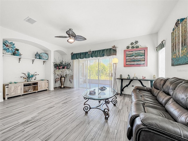 living room featuring ceiling fan and light hardwood / wood-style floors