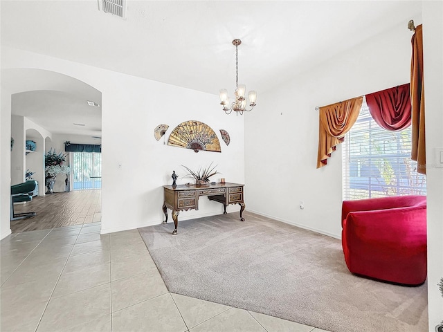 interior space featuring tile patterned floors and a chandelier