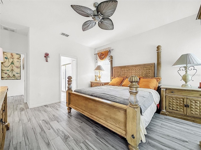 bedroom with light hardwood / wood-style floors and ceiling fan