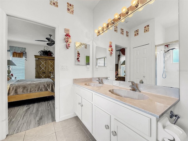 bathroom featuring vanity, tile patterned floors, and ceiling fan