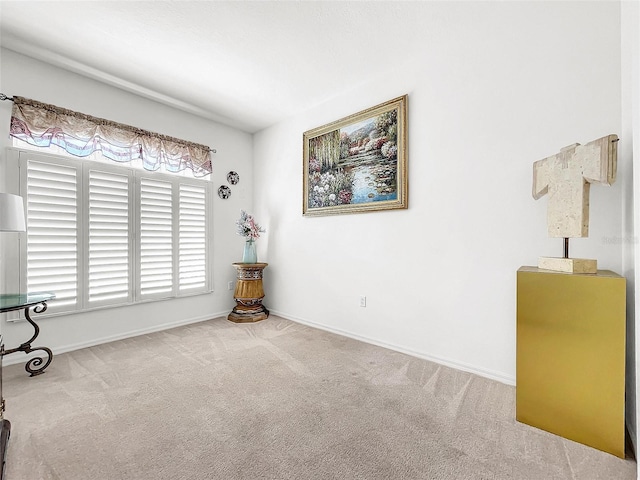 carpeted spare room featuring a wealth of natural light