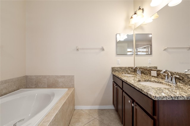 bathroom featuring tile patterned floors, tiled tub, and dual bowl vanity