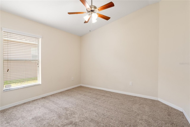 spare room with ceiling fan and carpet floors