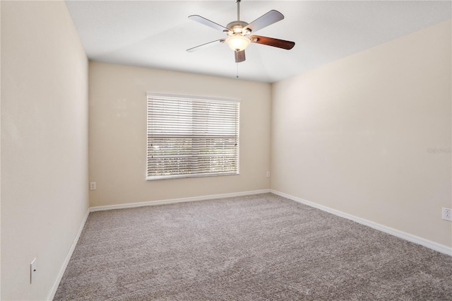 empty room featuring ceiling fan and carpet flooring