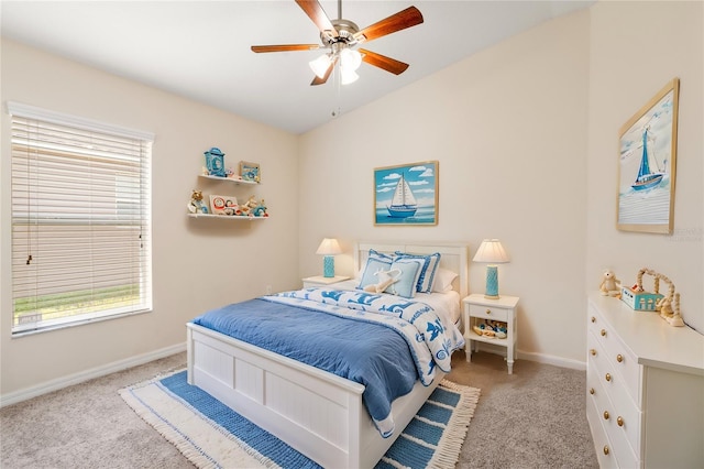 carpeted bedroom featuring ceiling fan and lofted ceiling