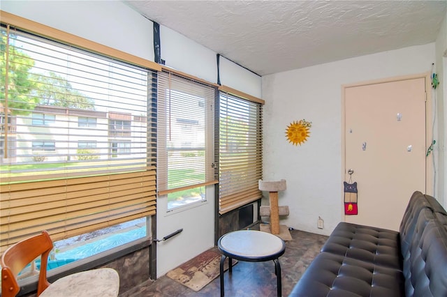 living room featuring a textured ceiling