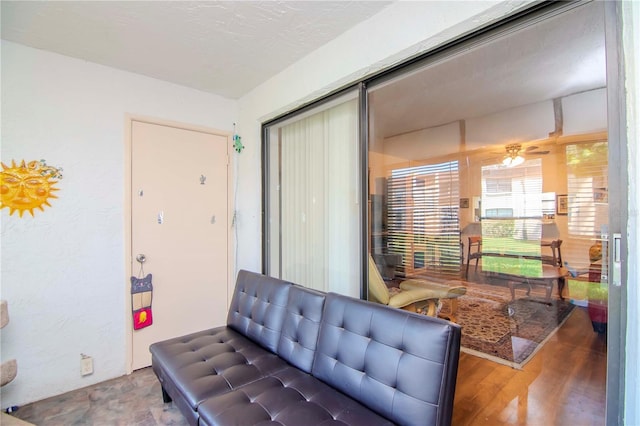 living room featuring hardwood / wood-style flooring and a textured ceiling