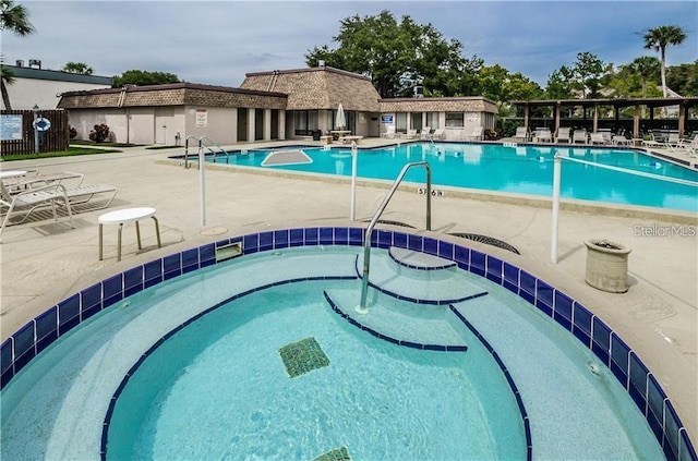 view of swimming pool featuring a patio area