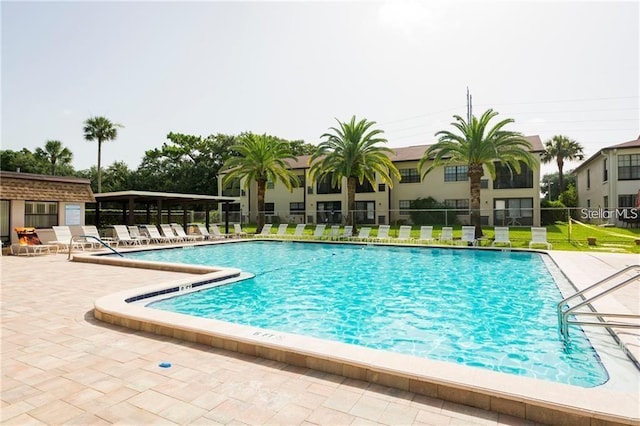 view of swimming pool with a patio