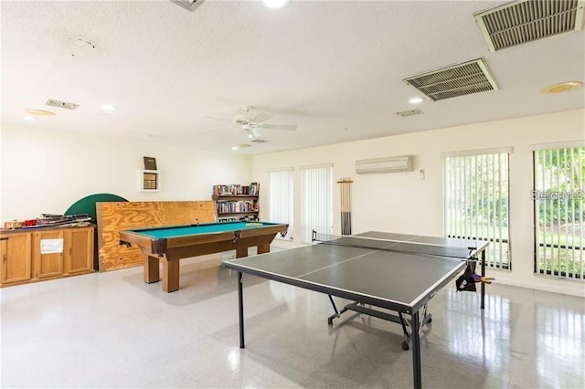 recreation room with pool table, a wall mounted AC, and ceiling fan