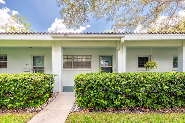 property entrance featuring covered porch