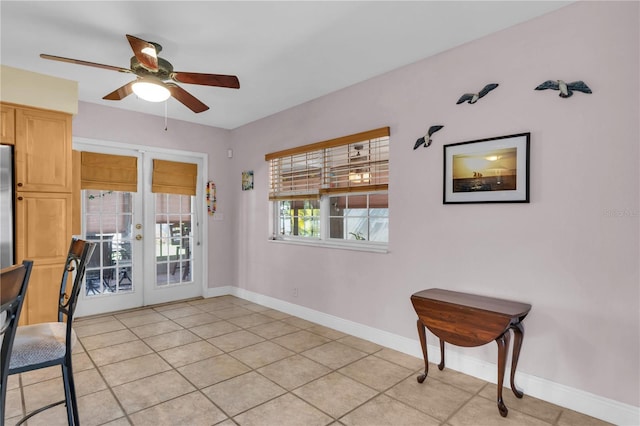 doorway to outside featuring ceiling fan, french doors, and light tile patterned floors