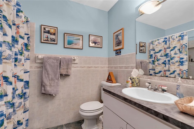 bathroom featuring backsplash, tile walls, tile patterned flooring, vanity, and toilet