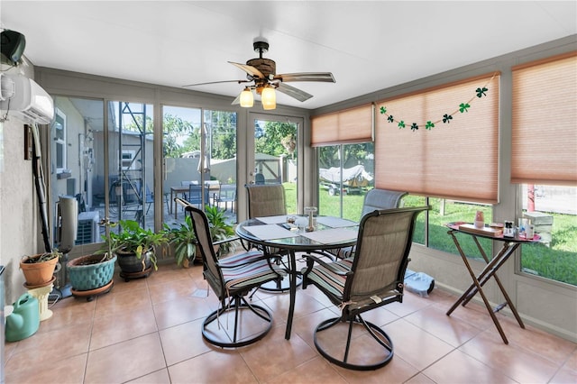 sunroom / solarium with ceiling fan and a wall mounted air conditioner