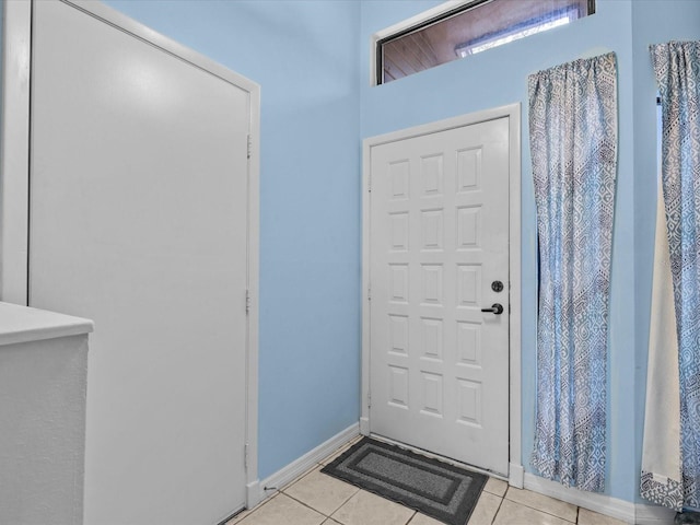 entrance foyer featuring light tile patterned floors