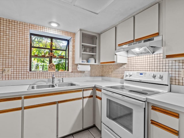 kitchen featuring sink, white cabinets, light tile patterned floors, and electric range