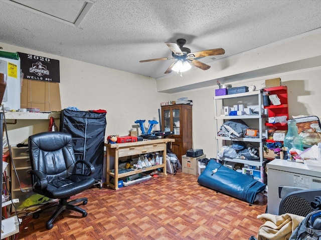 office space with ceiling fan, a textured ceiling, and parquet flooring