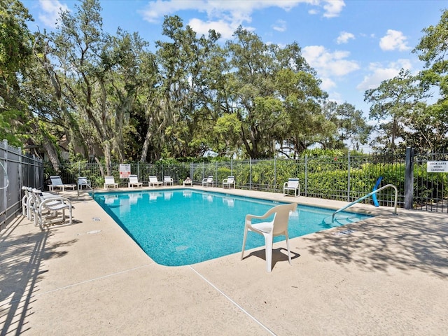 view of swimming pool with a patio area