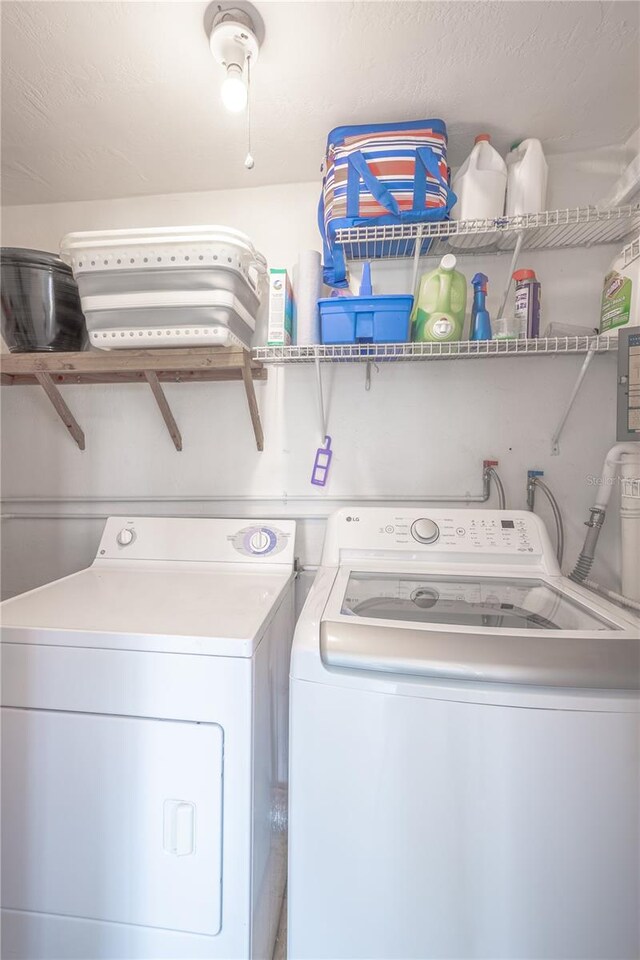 laundry room featuring washer and clothes dryer