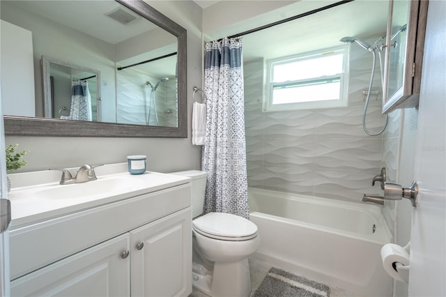 full bathroom with shower / tub combo, toilet, and vanity