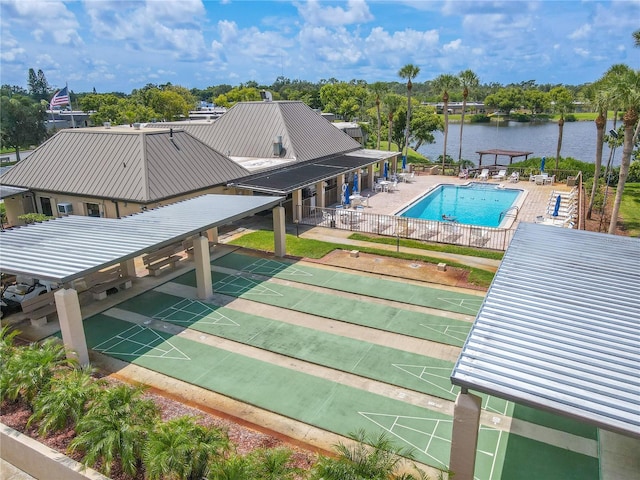 view of pool featuring a water view