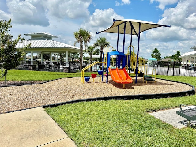 view of play area with a gazebo and a lawn