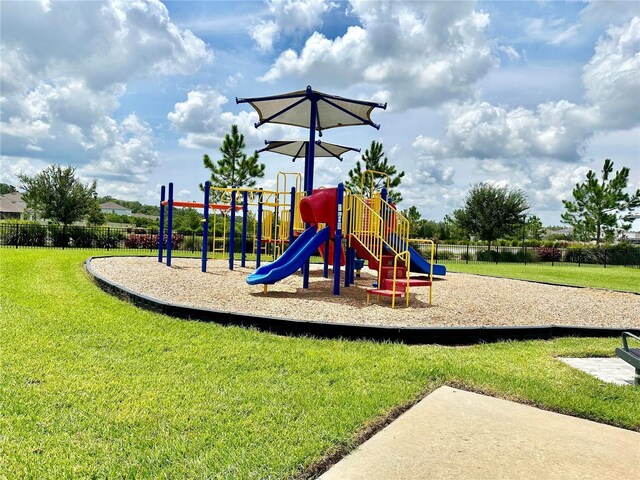 view of playground with a yard