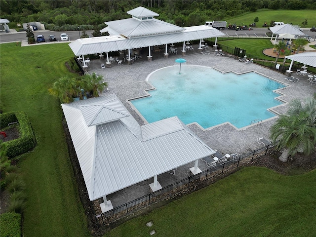 view of pool featuring a lawn and a patio area