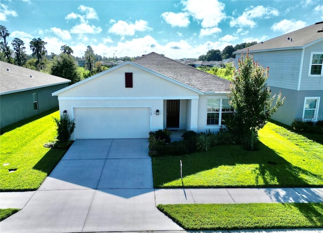 view of front of home featuring a front lawn and a garage