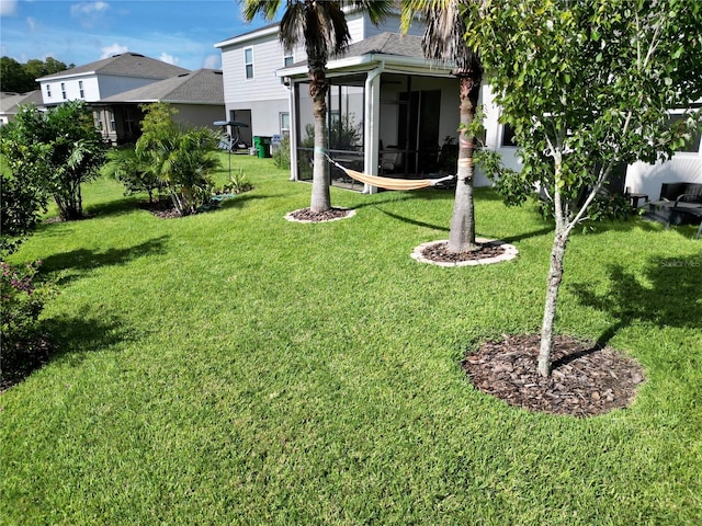 view of yard featuring a sunroom