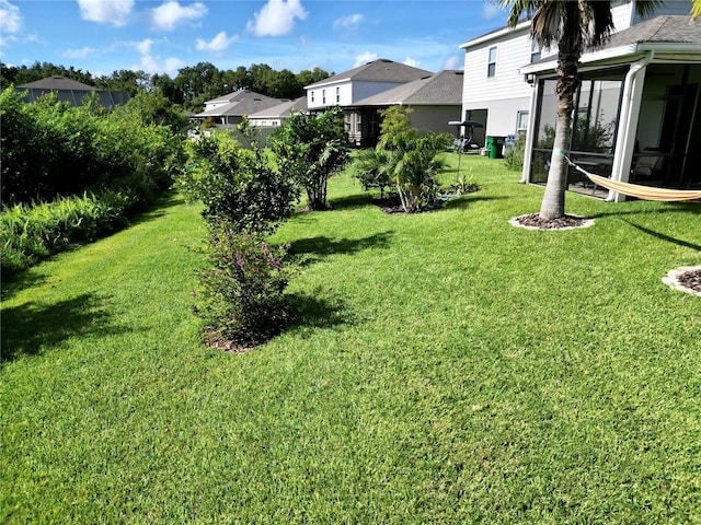 view of yard with a sunroom