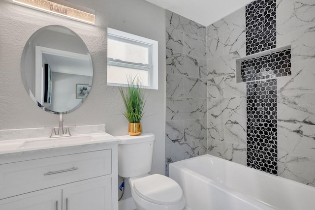 full bathroom featuring vanity, toilet, and tiled shower / bath