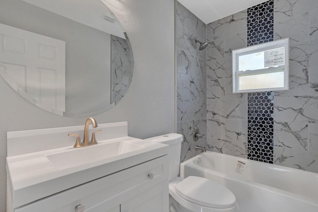 full bathroom with toilet, vanity, and tiled shower / bath combo