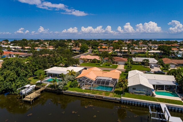 birds eye view of property featuring a water view